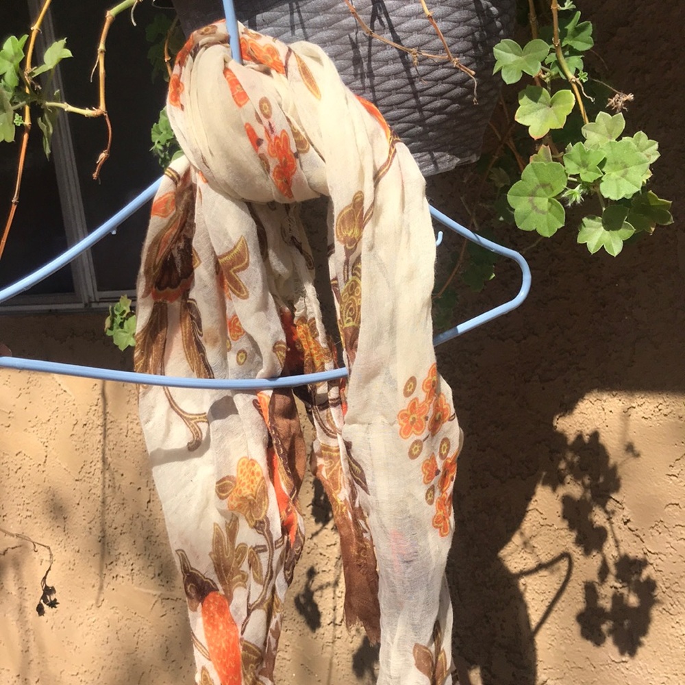 Airy cream scarf with brown and orange details